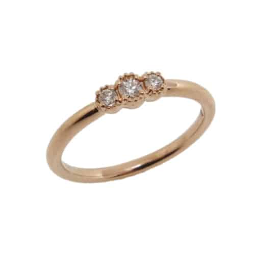 18K Rose gold lady's Behati Sweetheart Band by Hearts On Fire set with 3 ideal, round brilliant cut Hearts On Fire diamonds, 0.12cttw.