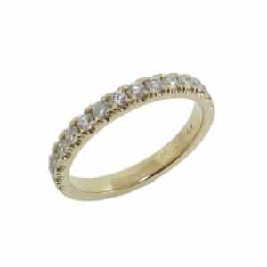 Lady's yellow gold diamond band set with fifteen round brilliant cut diamonds totaling 0.45 carats, G-H, VS-SI very good cut.
