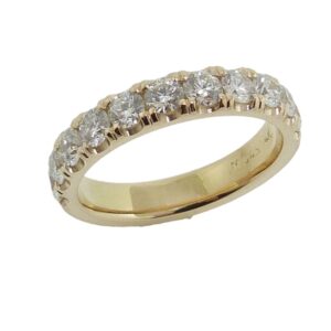 Lady's 14K yellow gold diamond band set with eleven round brilliant cut diamonds totaling 1.06 carats, G-H, VS-SI, very good cut.