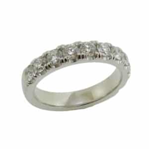Lady's 14K white gold diamond band, set with eleven very good round brilliant cut diamonds totaling 0.78 carats, G-H, VS-SI1. Available in 14K gold, 18K gold, or platinum. This ring can be made in any combination of white, pink or yellow gold and can be customized to accommodate different size and shape diamonds, by special order.
