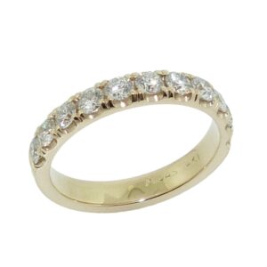 Lady's 14K yellow gold diamond band, set with eleven very good round brilliant cut diamonds totaling 0.78 carats, G-H, VS-SI1. Available in 14K gold, 18K gold, or platinum. This ring can be made in any combination of white, pink or yellow gold and can be customized to accommodate different size and shape diamonds, by special order.