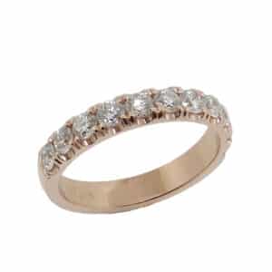Lady's 14K rose gold diamond band, set with eleven very good round brilliant cut diamonds totaling 0.78 carats, G-H, VS-SI1. Available in 14K gold, 18K gold, or platinum. This ring can be made in any combination of white, pink or yellow gold and can be customized to accommodate different size and shape diamonds, by special order.