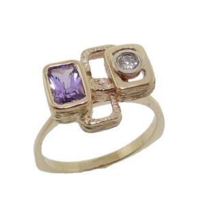 14K Yellow gold custom Studio Tzela custom ring set with a 0.07ct SI round brilliant cut diamond and a 0.58 carat purple sapphire.