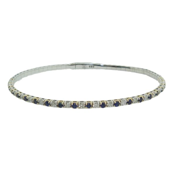 14K White and yellow gold lady's bangle set with sapphires, 0.64cttw, and diamonds, 0.54cttw, J/K, SI2-I1, very good cut round brilliant cut diamonds.