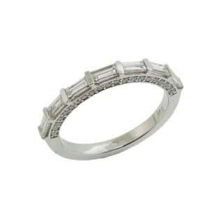 14K White gold diamond band channel set with 7 baguette diamonds, 0.60cttw, and in the profile pave set with 42 round brilliant cut diamonds, 0.25cttw.