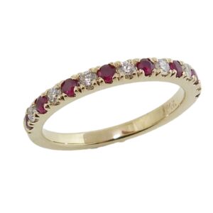 14K Yellow gold lady's band set with 7 round brilliant cut diamonds, 0.19cttw, and 8 ruby's, 0.27cttw.