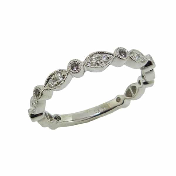 14K White gold scalloped edge band set with 0.22 total carat weight diamonds.