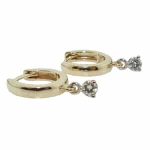 Lady's 14K gold huggie earrings with two claw-set, H-I, SI1, very good cut, diamonds totaling 0.147 carats.