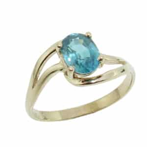 14K Yellow gold lady's ring 1.265 carat oval blue zircon.