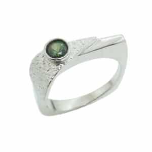 Lady's 14K white gold square shank ring with texture and a bezel-set with 0.25 carat round green tourmaline.