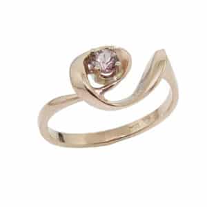 Lady's 14K rose gold ring set with one 3.5 mm round lotus garnet.