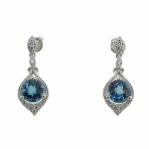 14K White gold dangle earrings set with 0.12cttw diamonds and 2 London blue topaz, 2.10cttw.