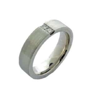 14K White gold men's pipestyle 6mm band with stainless texture channel set with 2 princess cut diamonds, 0.25 total carat weight. 