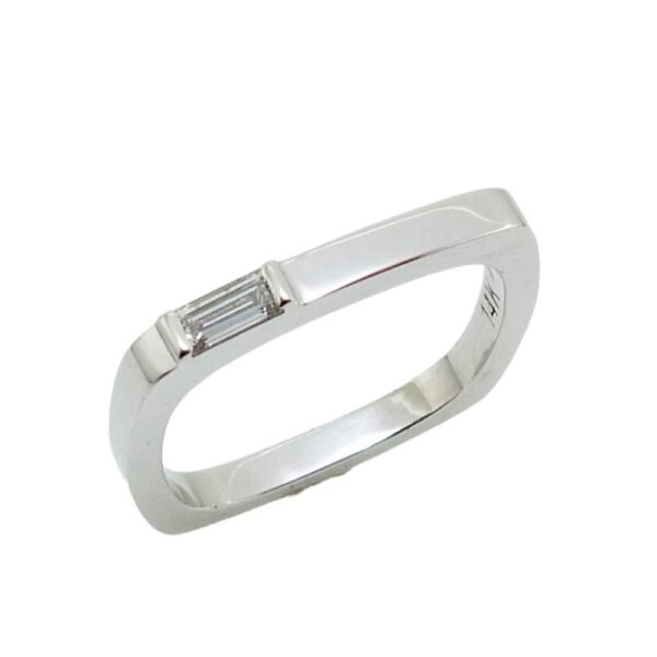 14K white gold square shank band set with a 0.099 carat, F-G, VS baguette diamond.