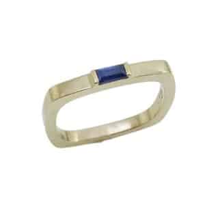14K yellow gold square shank ring set with 0.16ct baguette blue sapphire.