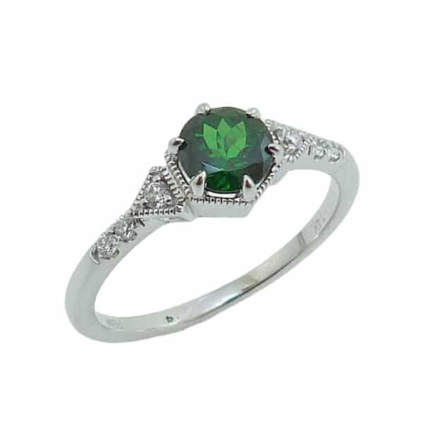 14K white gold ring set with 0.759 carat round Tsavorite and accented with 6 round brilliant cut diamonds totaling 0.09 carat, G-H, SI.