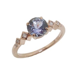 14K Rose gold ring set with 1.07 carat round Peacock Tanzanite and accented with 6 round brilliant cut diamonds totaling 0.07 carat, G-H, SI.