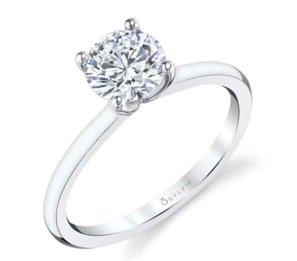 14K White gold engagement ring by Sylvie Collection engagement ring set in the centre with a 0.75 carat CZ and accented on the petal shape tips with round brilliant cut diamonds, 0.08 total carat weight, G/H, VS-SI. Available in 14K gold, 18K gold, or platinum. This ring can be customized to accommodate different size and shape diamonds, by special order. Priced without a center gemstone. Let us find you the perfect center that fits your tastes and budget!