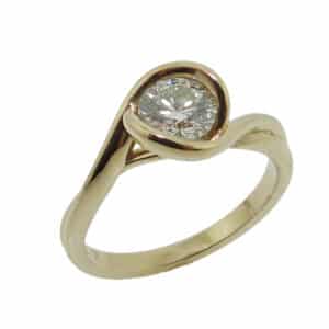 14K Y ellow gold solitaire engagement ring semi-bezel set with a 0.66ct J, VS2.