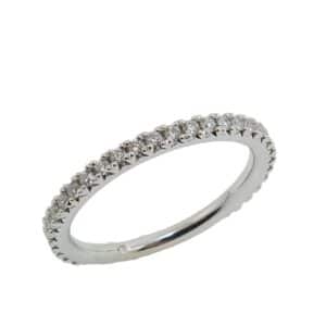 14K White gold diamond band french set with 24 very good-excellent cut, round brilliant cut diamonds, totaling 0.11 carats, F-G, VS.