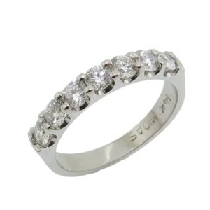 14K White gold claw set diamond band set with 7 round brilliant cut diamonds, 0.74 total carat weight, G/H, VS-SI. Special Sale price $1895 while they last - only 5 available!