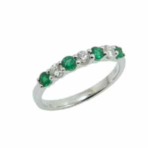 18K White gold claw set alternating four emeralds, 0.32 total carat weight, and three diamonds, 0.24 total carat weight, G/H, SI1, lady's band.