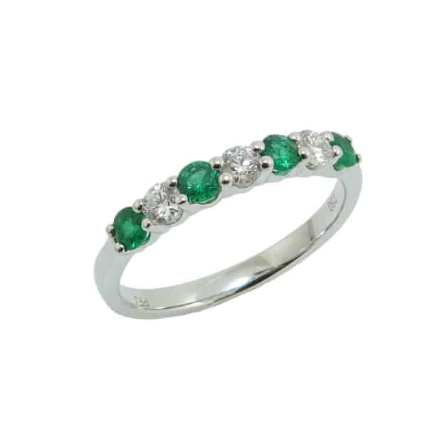 18K White gold claw set alternating four emeralds, 0.32 total carat weight, and three diamonds, 0.24 total carat weight, G/H, SI1, lady's band.