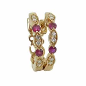 14K Yellow gold ruby and diamond hoop earrings set with rubies totaling 0.12 carats and round brilliant cut diamonds totaling 0.06 carats, G/H, SI1.