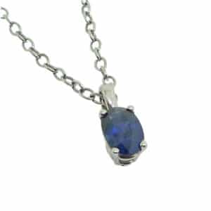 14K White gold pendant set with a 0.50 carat oval blue sapphire.