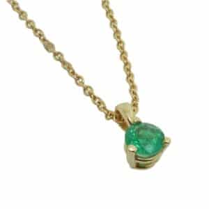 14K Yellow gold 0.20 carat emerald pendant.