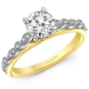 14K White and yellow gold engagement ring by Ancora Designs set in the centre with a 1.0 carat CZ and accented on the sides with 16 round brilliant cut diamonds, 0.13 total carat weight. Available in 14K gold, 18K gold, or platinum. This ring can be made in any combination of white, pink or yellow gold and can be customized to accommodate different size and shape diamonds, by special order. Priced without a center gemstone. Let us find you the perfect center that fits your tastes and budget