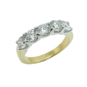 14K White and yellow gold lady's band claw set with five very good cut, round brilliant cut diamonds totaling 1.35 carats, SI1-2, G/H.