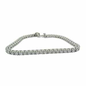 14K White gold tennis bracelet claw set with fifty-three lab grown diamonds totaling 5 carats, G/H, SI1-VS2.