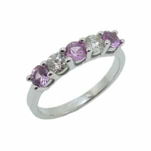 14K White gold lady's ring set with two excellent cut, round brilliant cut diamonds totaling 0.303 carats, SI2, I/J and three round pink sapphires totaling 0.615 carats.