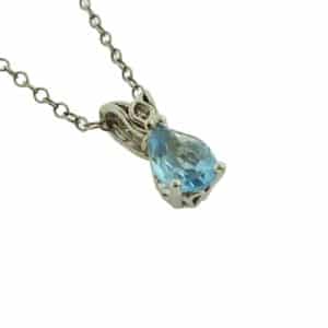 14K White gold pendant set with one 0.50 carat pear shaped blue topaz.