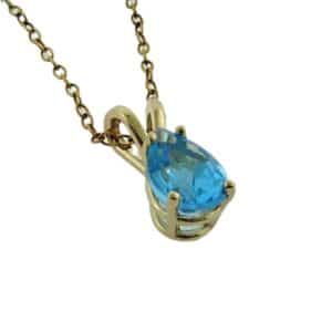 14K Yellow gold pendant set with one 0.50 carat pear shaped blue topaz.