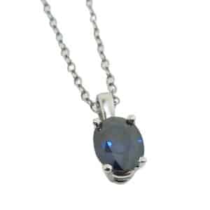 14K White gold pendant set with one 0.289 carat blue oval sapphire.