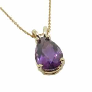 14K Yellow gold pendant set with a 3.32 carat pear shape amethyst.