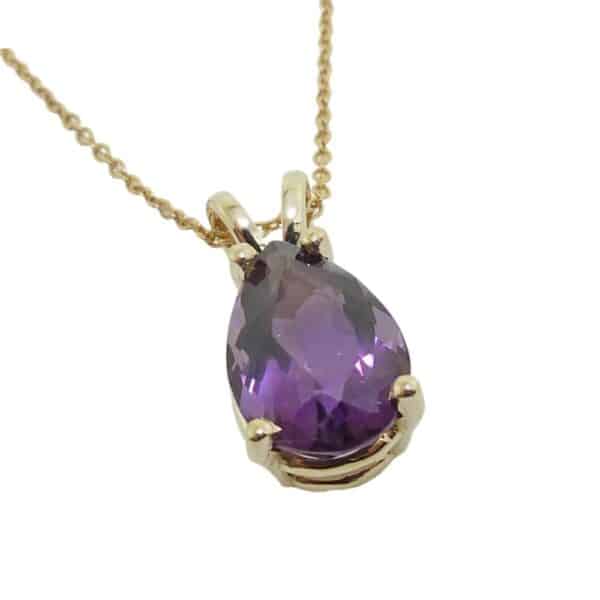 14K Yellow gold pendant set with a 3.32 carat pear shape amethyst.