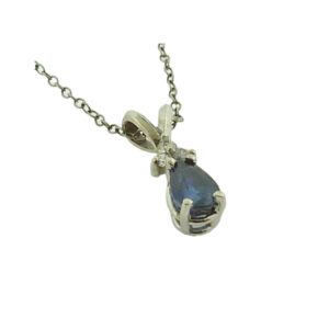 14K White gold pendant set with 0.794 carat blue sapphire and accented with 3 round brilliant cut diamonds totaling 0.065 carats, G-H, SI1-2.
