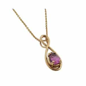 14K Rose gold pendant set with 0.848 carat pear shaped pink sapphire.