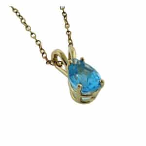 14K Yellow gold pendant set with 1.00 carat pear shaped blue topaz.