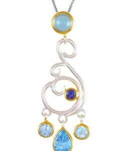 Sterling Silver and 22K Gold Vermeil Pendant by Michou Jewelry with three shades of Blue Topaz.