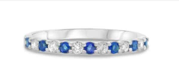 14K White gold lady's ring set with 6 round brilliant cut diamonds, 0.15cttw, and 7 sapphires, 0.24cttw.