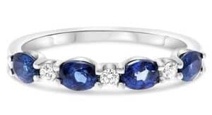 14K White gold lady's ring set with 4 oval sapphires, 1.00cttw, and 3 round brilliant cut diamonds, 0.09cttw.