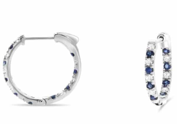14K White gold inside out hoop earrings set with 16 sapphires, 0.75cttw, and 12 round brilliant cut diamonds, 0.42cttw.