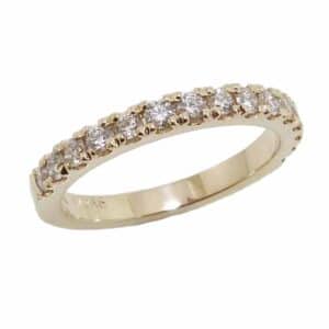 14K Yellow gold claw set diamond band set with 15 round brilliant cut diamonds, 0.45 total carat weight, G/H, VS-SI. Available in 14K gold, 18K gold, or platinum. This band can be made in any combination of white, pink or yellow gold and can be customized to accommodate different size and shape diamonds, by special order.