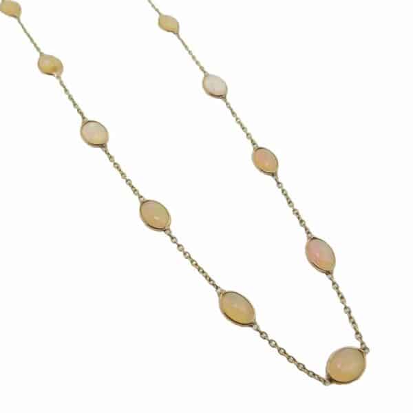 14K Yellow gold necklace bezel set with 17 oval jelly opals, 4.40 total carat weight.