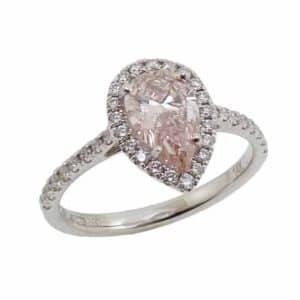 14K White gold halo engagement ring set in the centre with a 1.04 carat pear shape fancy intense pink lab grown diamond, VS2 and accented on the halo and band with thirty-seven claw set round brilliant cut lab grown diamonds, 0.34 total carat weight, G/H/I, VS2-SI1.