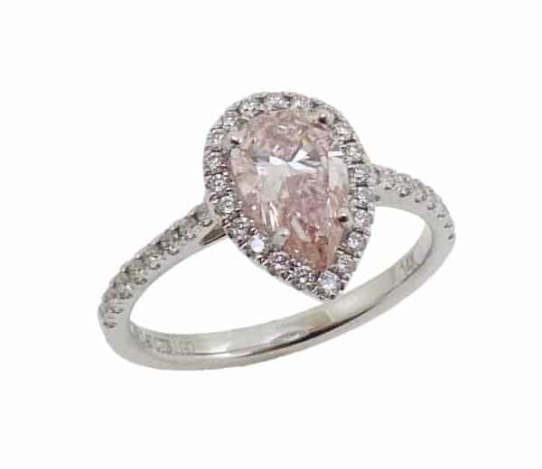 14K White gold halo engagement ring set in the centre with a 1.04 carat pear shape fancy intense pink lab grown diamond, VS2 and accented on the halo and band with thirty-seven claw set round brilliant cut lab grown diamonds, 0.34 total carat weight, G/H/I, VS2-SI1.